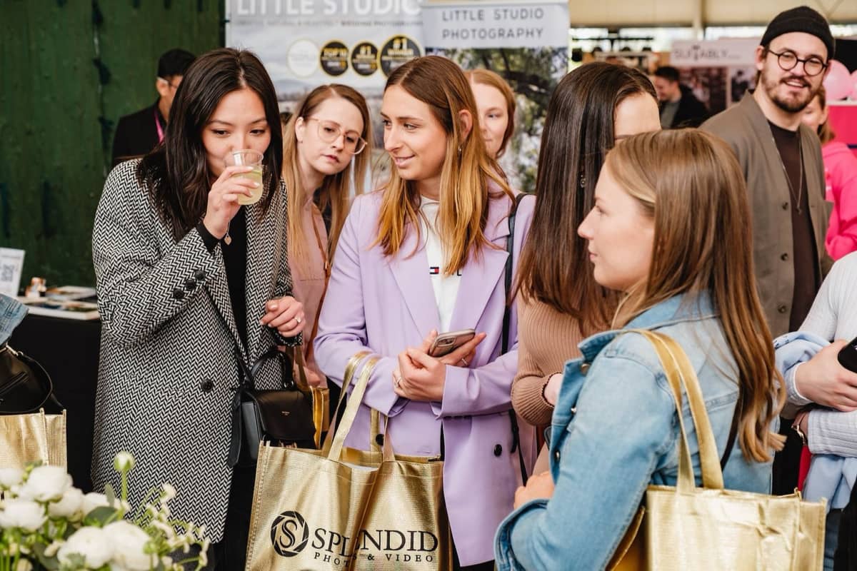 Couples browsing exhibitor stands at a Wedding Expos Australia event